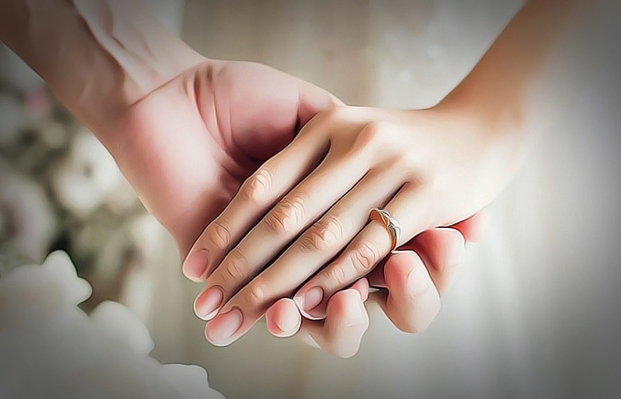 Beautifully retouched wedding photo of couple holding hands